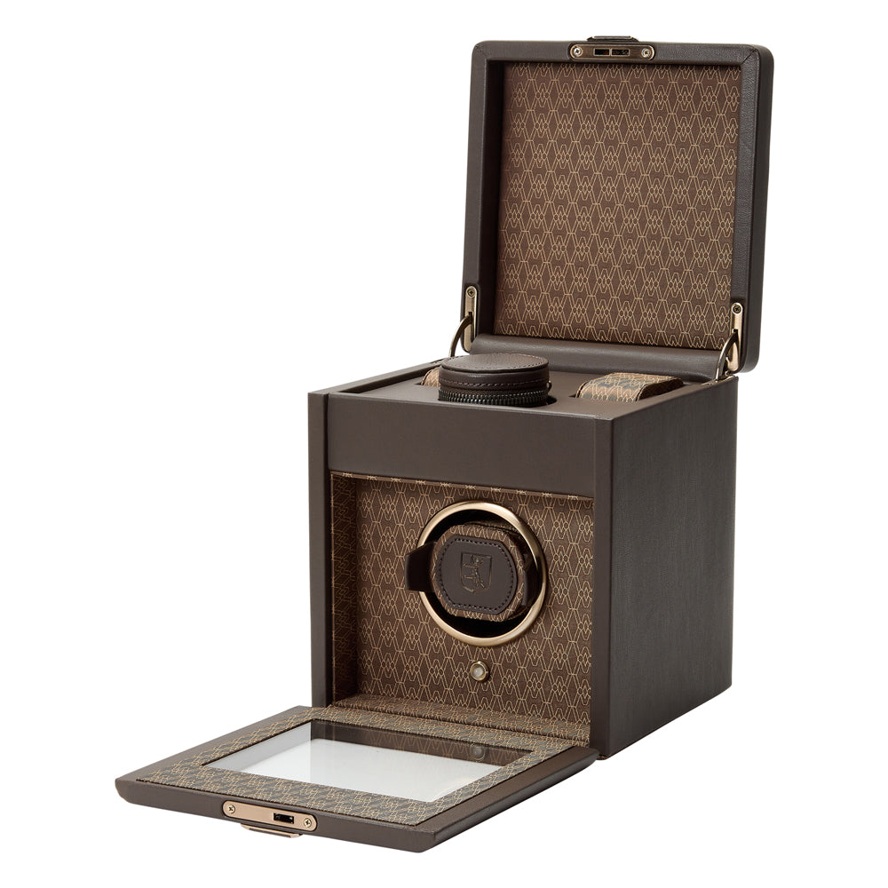 Brown watch winder with open lid on a white background