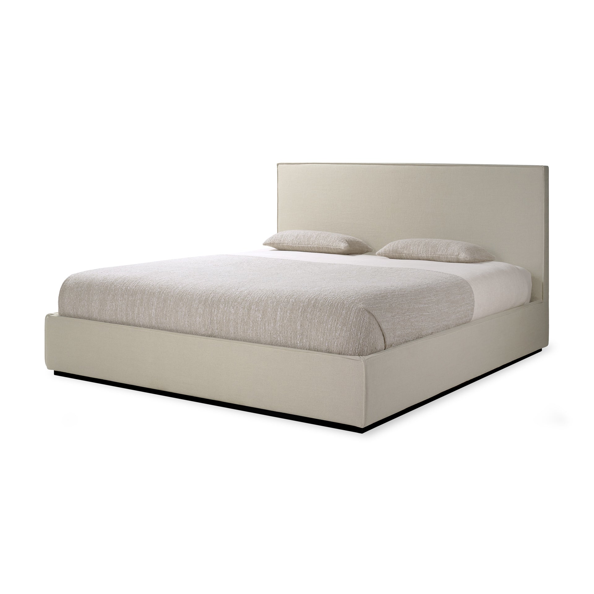 Beige upholstered bed with white bedding on a white background