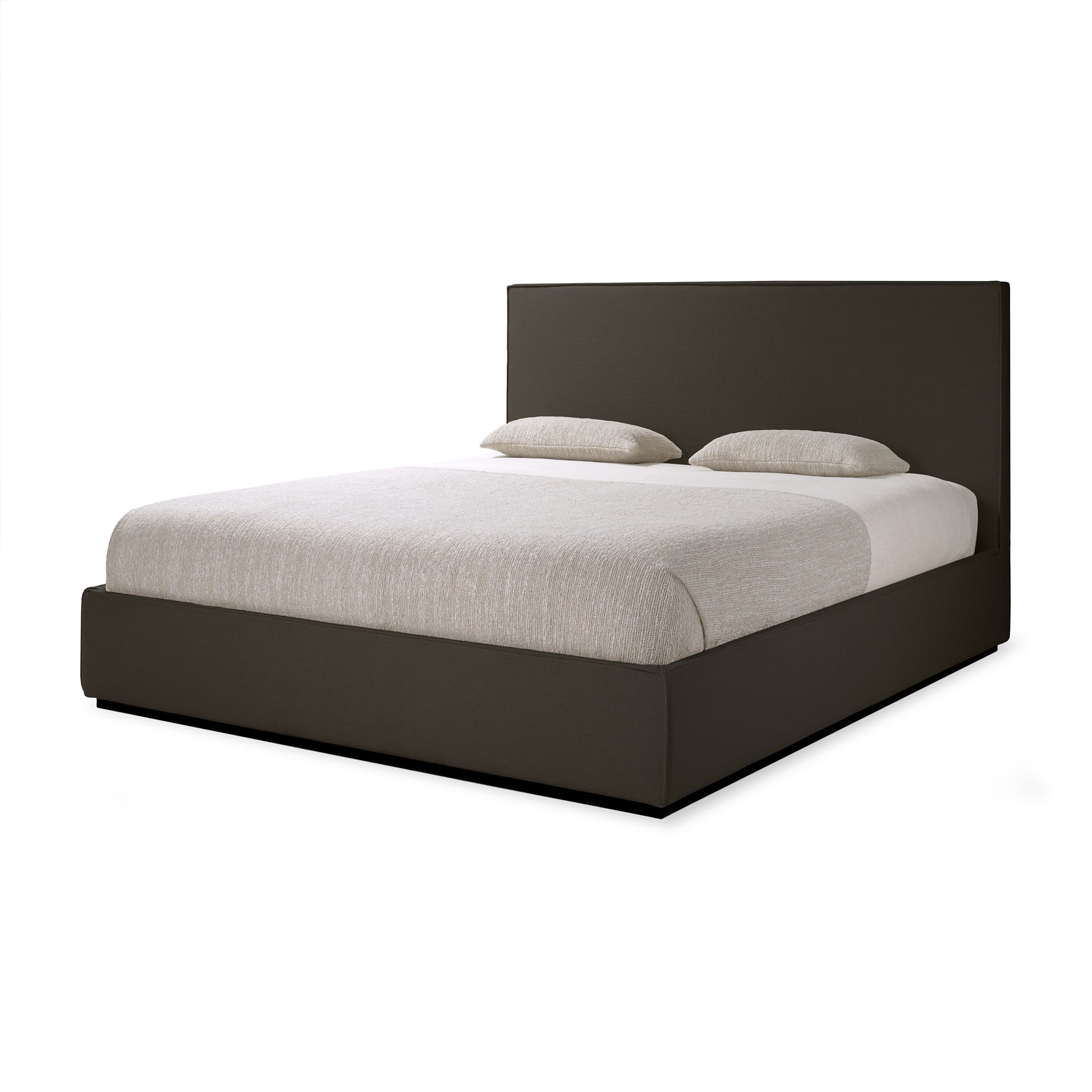 Bed with white bedding and dark brown frame on a white background