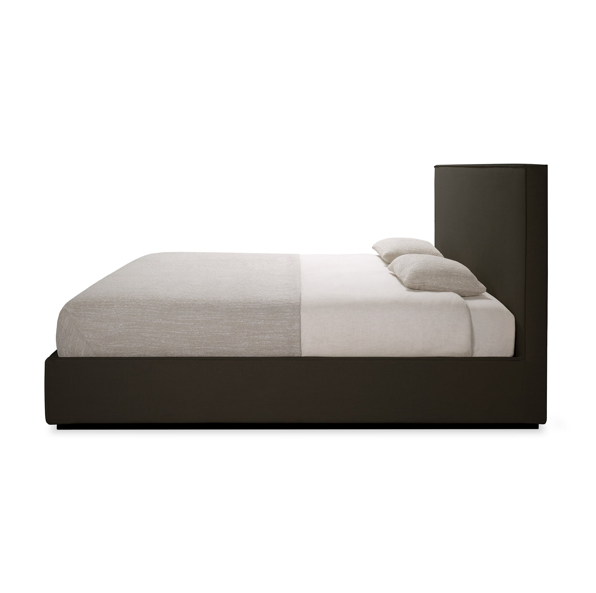 Bed with black frame and white bedding on a white background