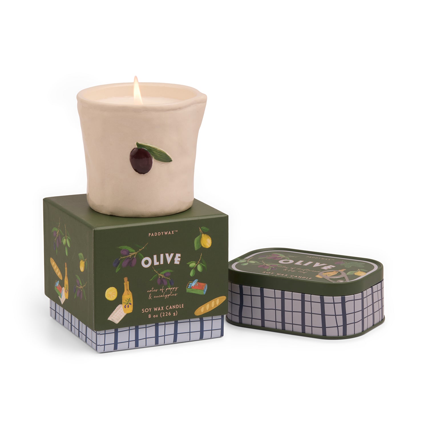 Candle in a decorative container with 'Paddywax' branding on a white background