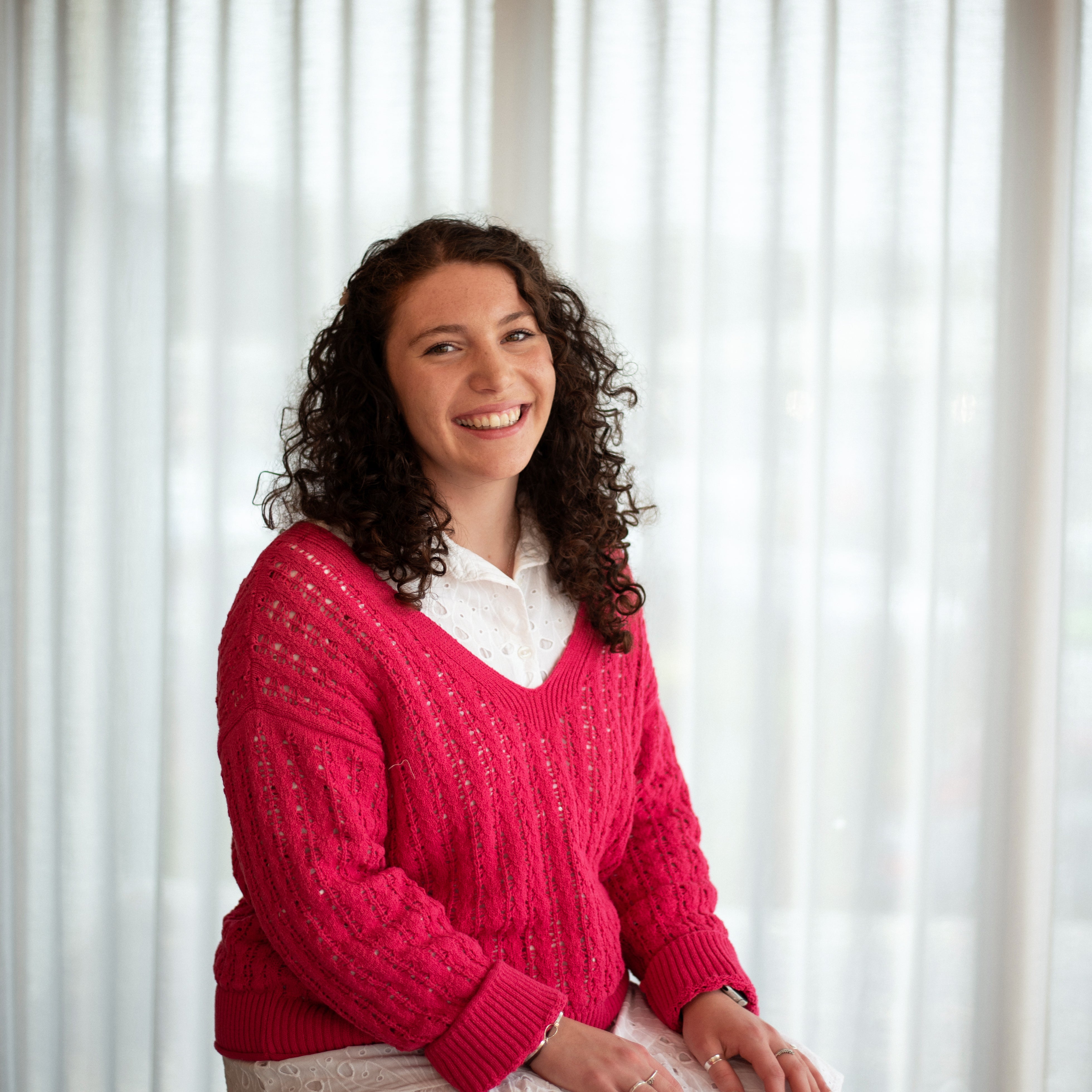 Belle, window dressings consultant at Iroka Interiors in Hayle, Cornwall—expert in bespoke blinds and curtains, offering tailored solutions for residential interiors.