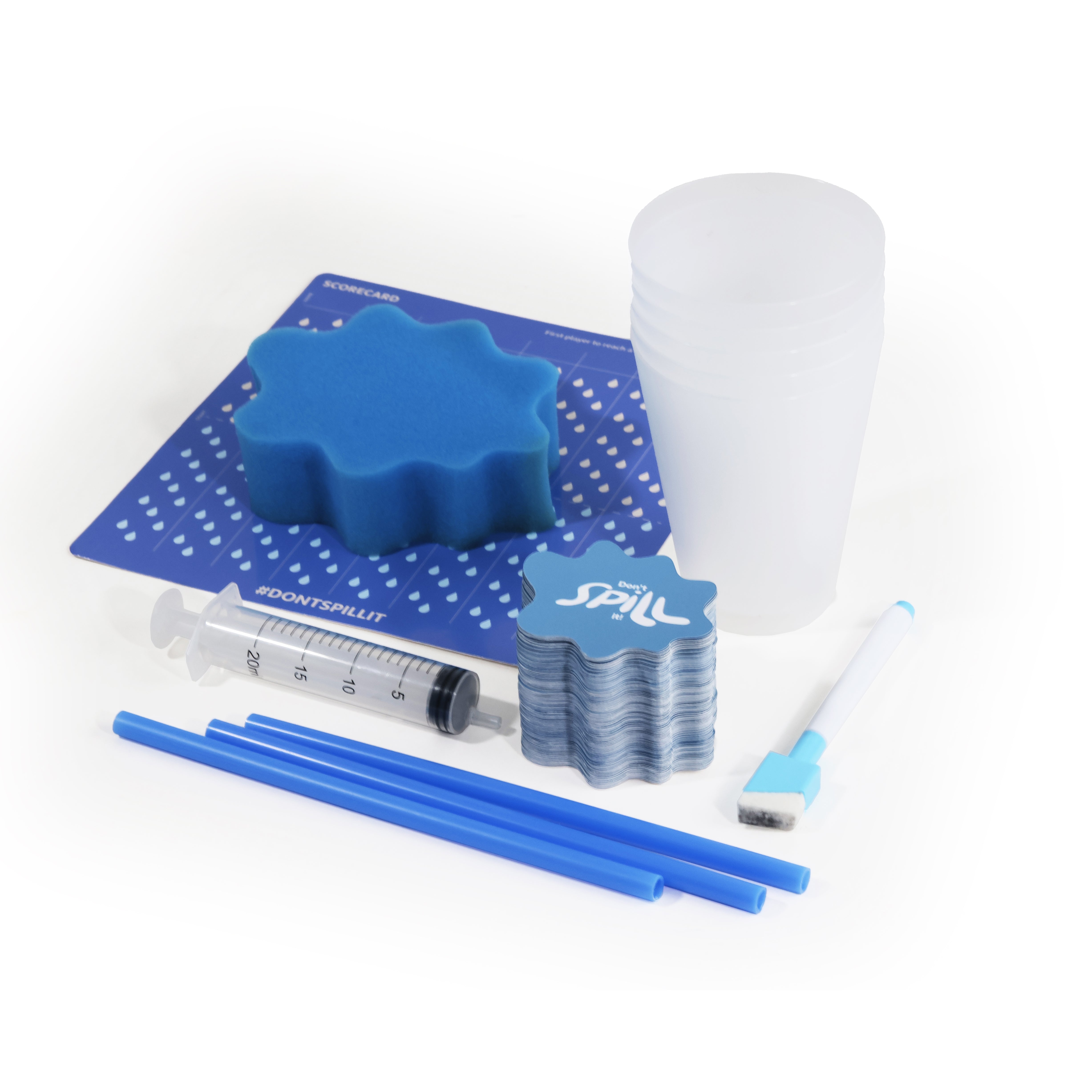 DON'T SPILL IT GAME with white background, containing a blue flower-shaped sponge, a stack of clear plastic cups, a syringe, blue straws, a blue-and-white brush, and a blue card with printed text.