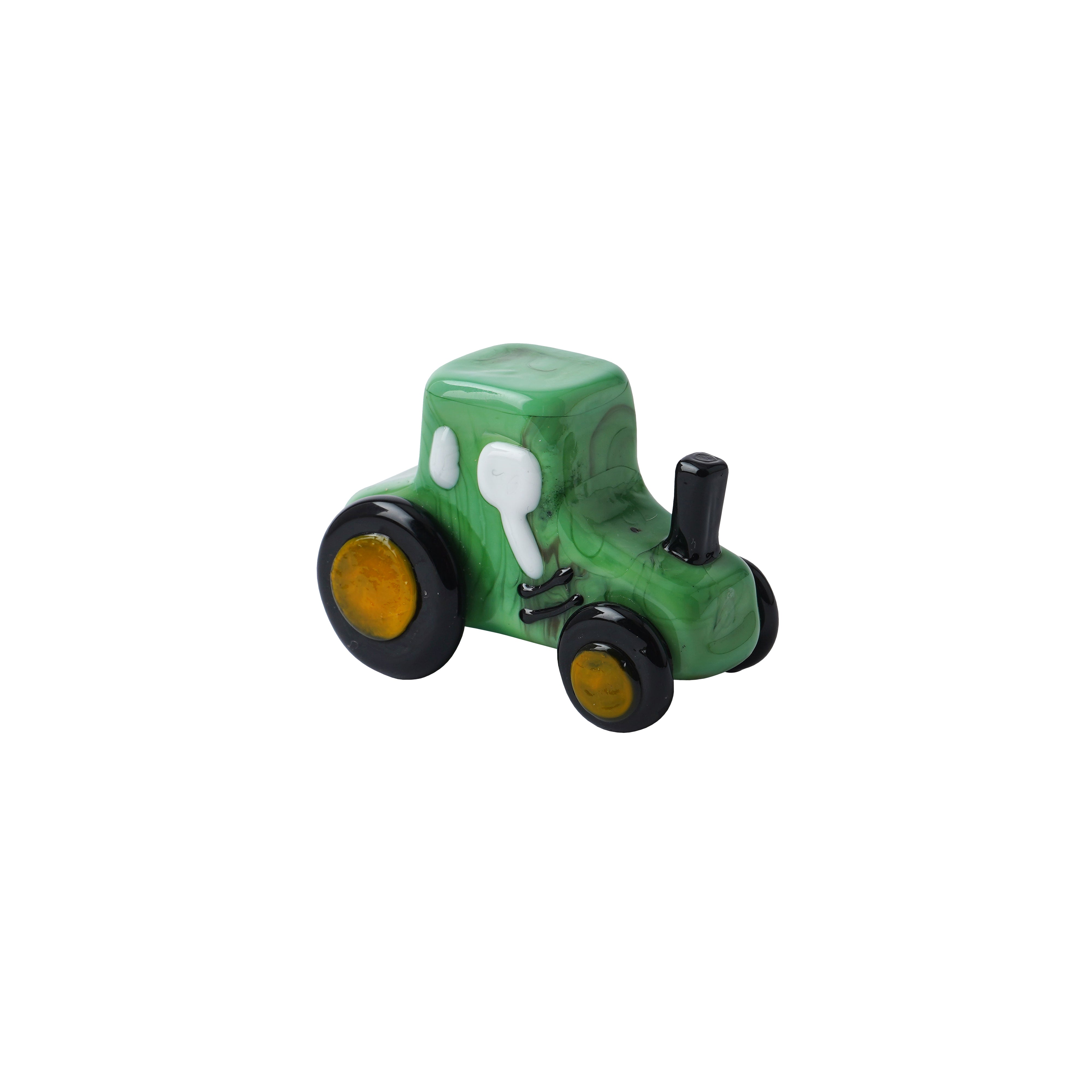 Small green artisan glass tractor on a white background