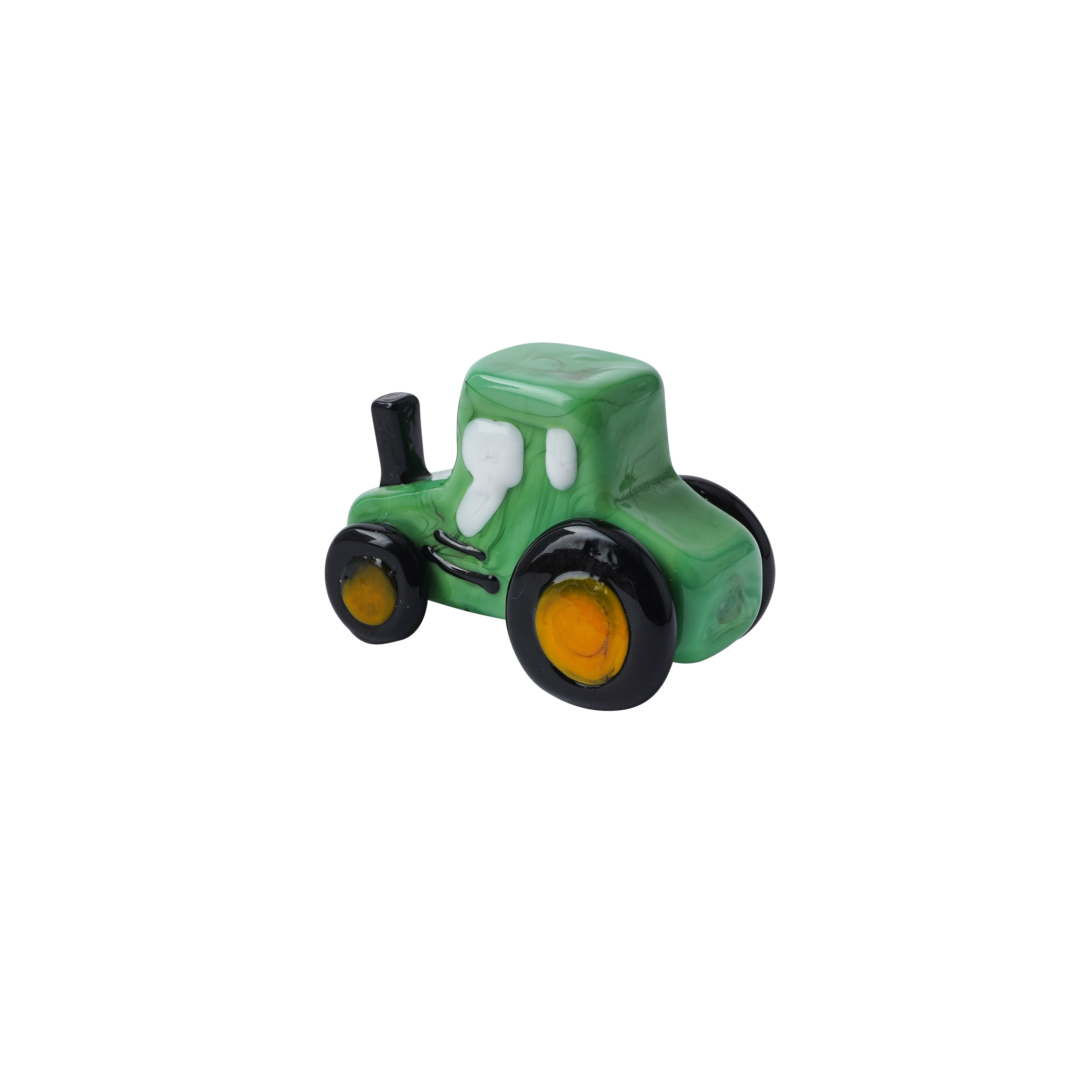 Small green artisan glass tractor with black wheels on a white background.