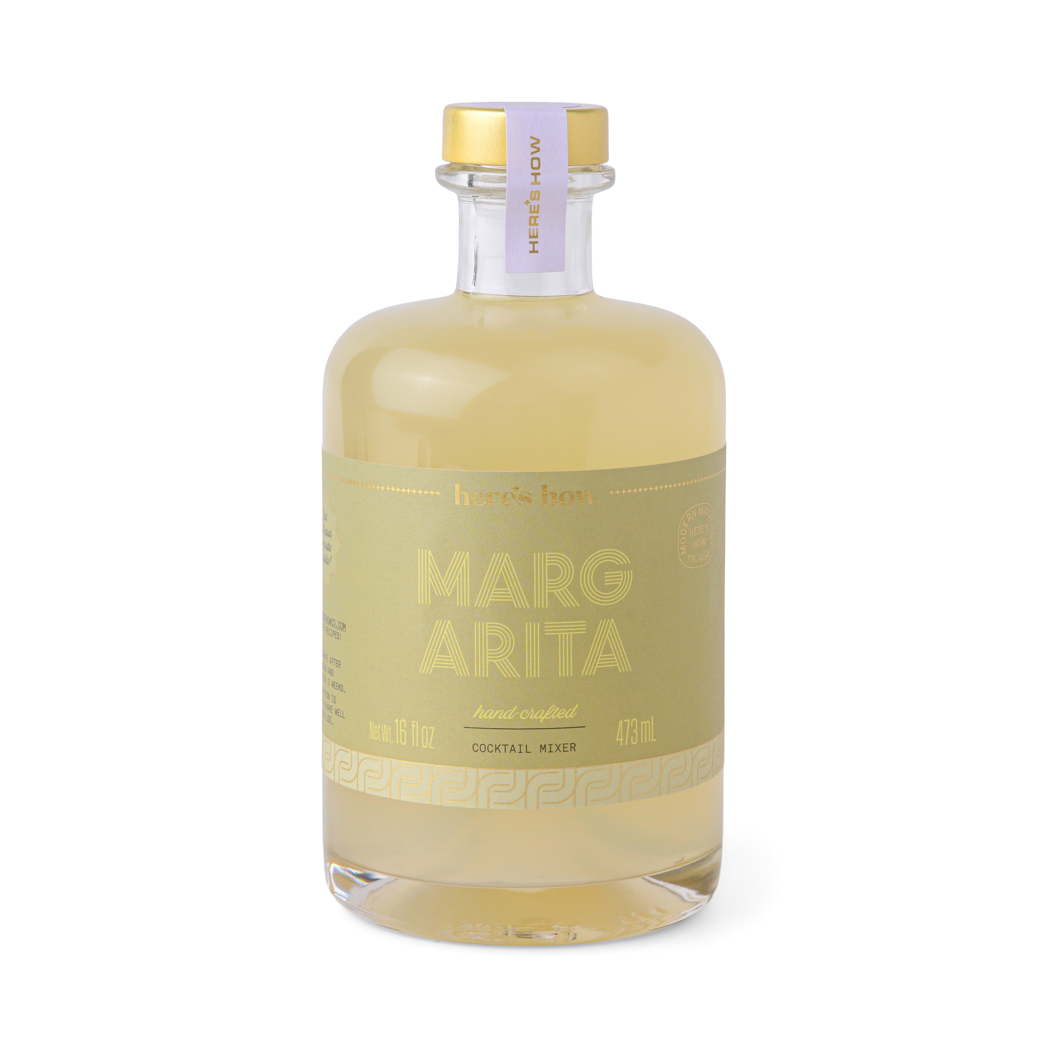 A bottle of Designworks Margarita Mix with a yellow label and gold top.