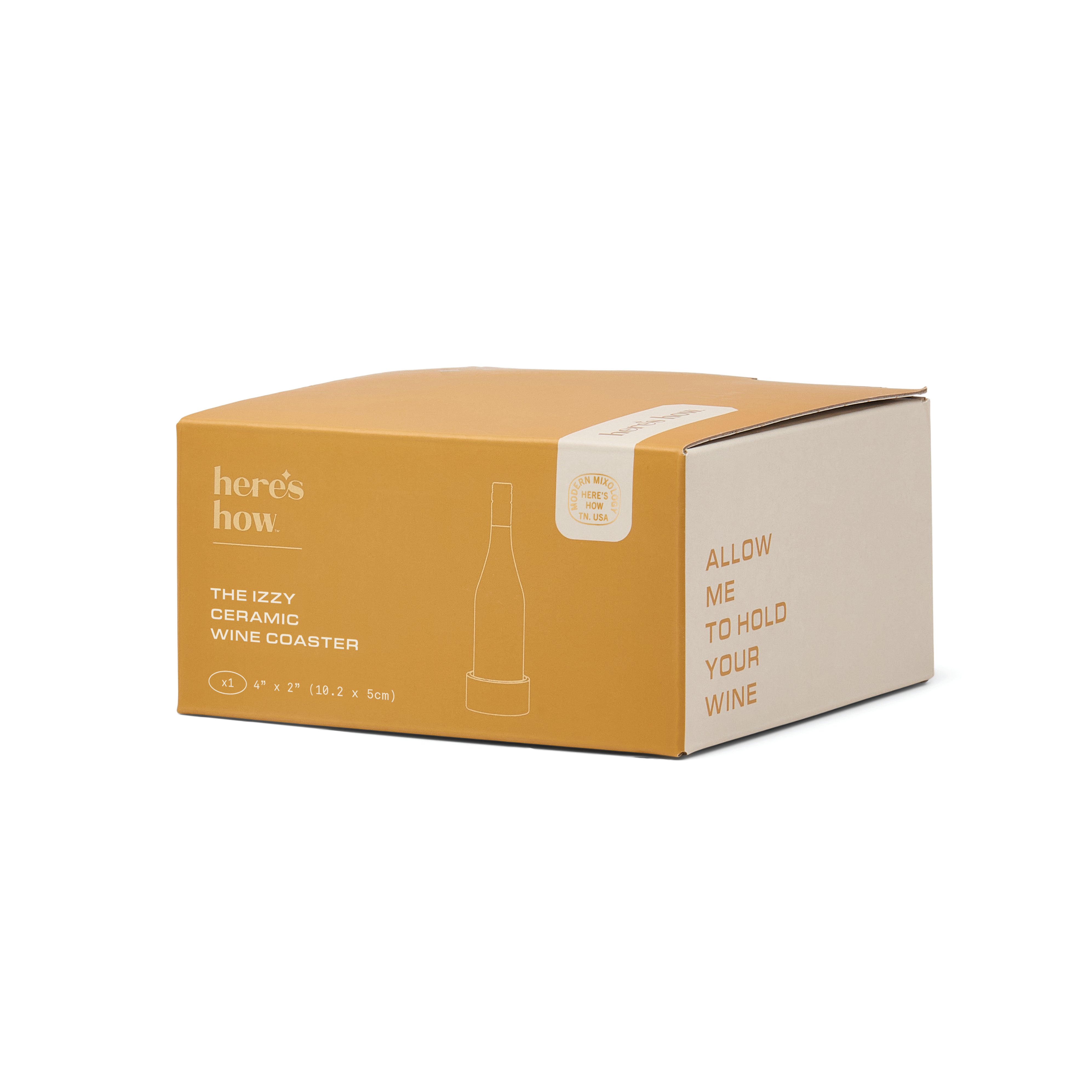 A cardboard product box for a wine coaster, shown at a three-quarter angle on a white background. The box is mustard yellow on top and side, with a cream-colored front panel featuring the text 'here's how' and 'THE IZZY CERAMIC WINE COASTER'.