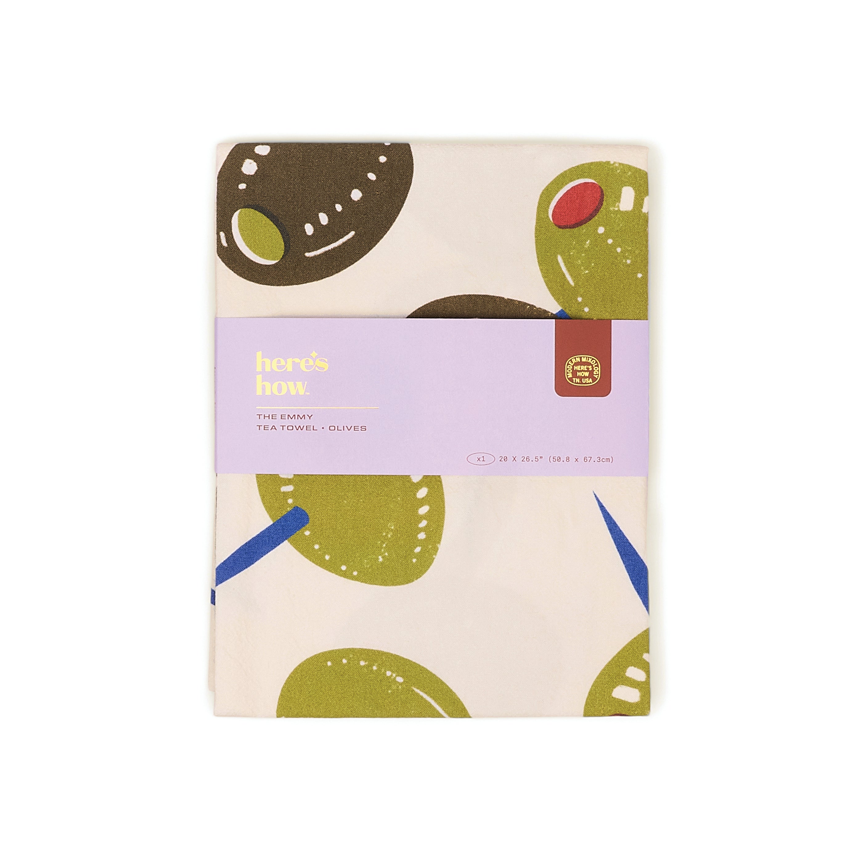 Tea towel with green abstract designs on a white background