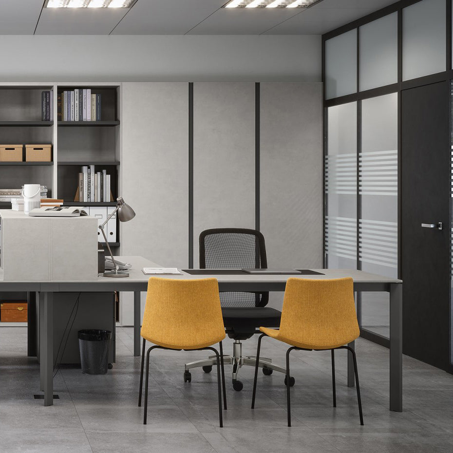 Modern office interior featuring sleek grey desks, ergonomic mesh office chair, bold mustard guest seating, and minimalist shelving – perfect for stylish commercial workspace design."