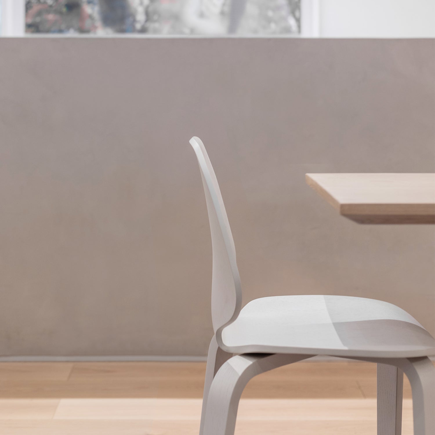 Minimalist outdoor restaurant seating in Cornwall designed by Iroka Interiors – showcasing modern light-toned chairs and wooden tables on a sunlit terrace, ideal for contemporary contract furniture and hospitality spaces.