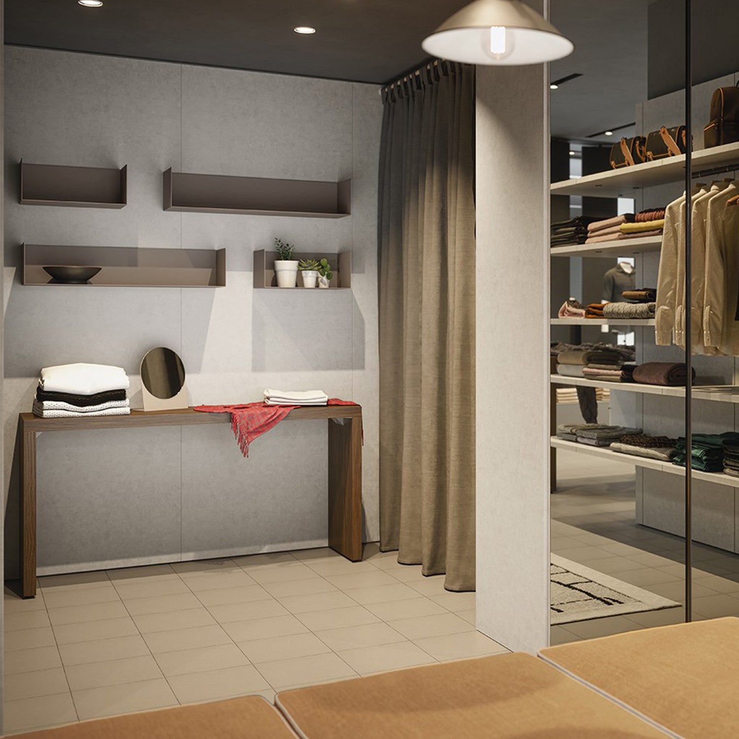 Contemporary retail changing room and display area designed by Iroka Interiors, featuring minimalist floating shelves, warm wood accents, soft lighting, and tailored merchandising for a luxury boutique experience.