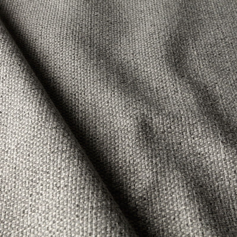 Detail of Mastrella “Star” fabric in light grey, showcasing its soft basketweave texture and refined neutral tone - ideal for minimalist and contemporary furniture upholstery.