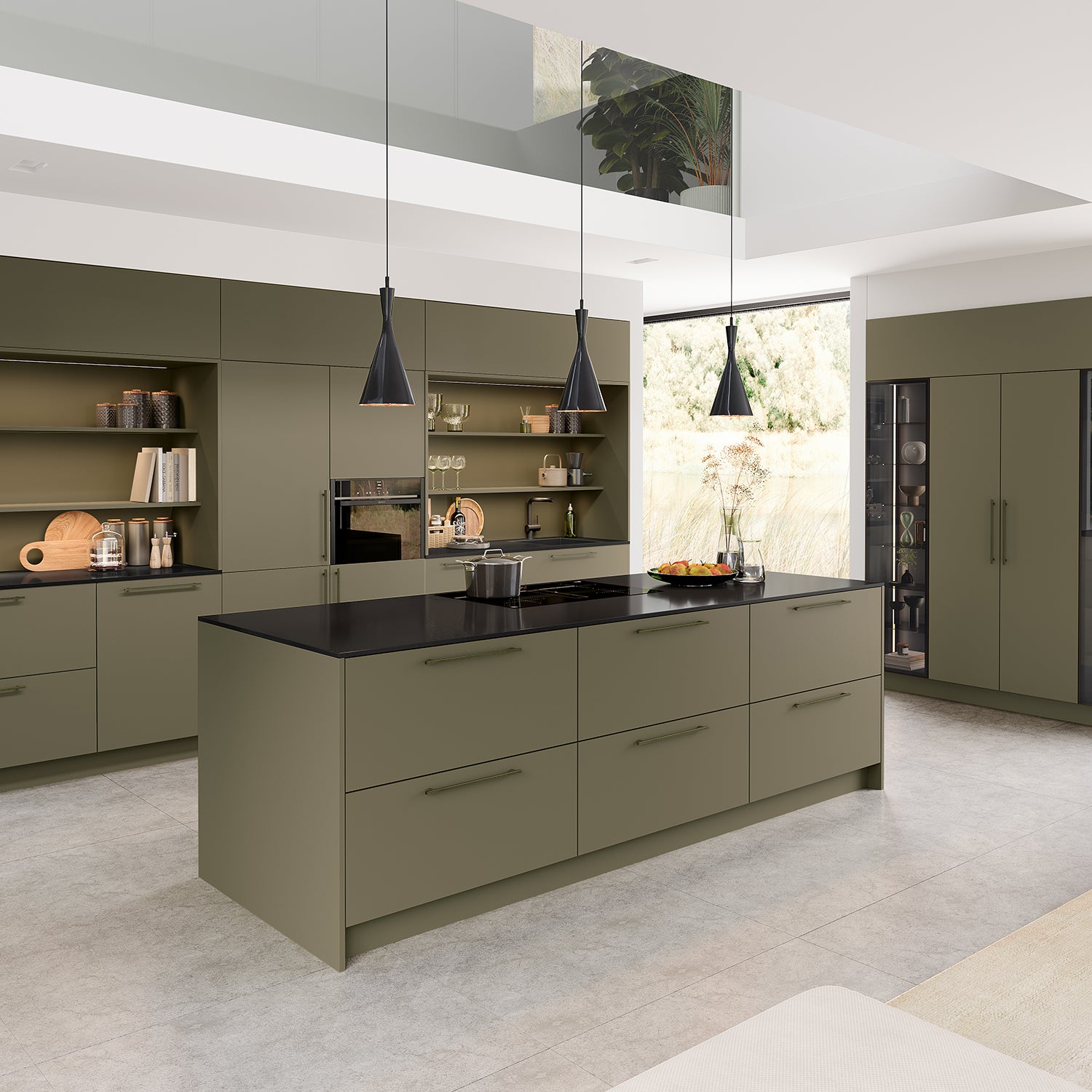 Contemporary German Schröder kitchen in matte olive green with minimalist flat-panel cabinetry, black quartz worktops, integrated appliances, and sleek pendant lighting – premium modern kitchen design and installation in Cornwall by Iroka Interiors.