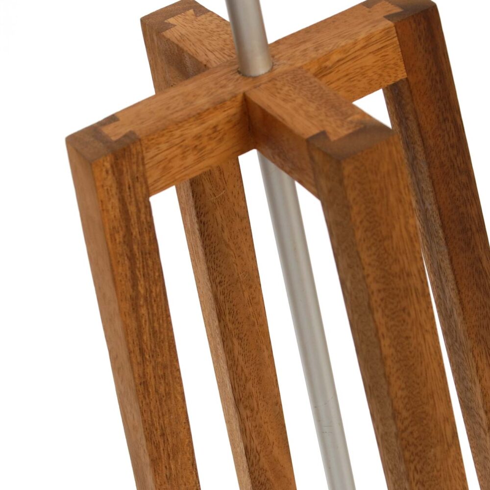 Close-up of a wooden tripod floor lamp stand with a warm medium-brown wood finish and a silver metal vertical post, shown against a plain white background.