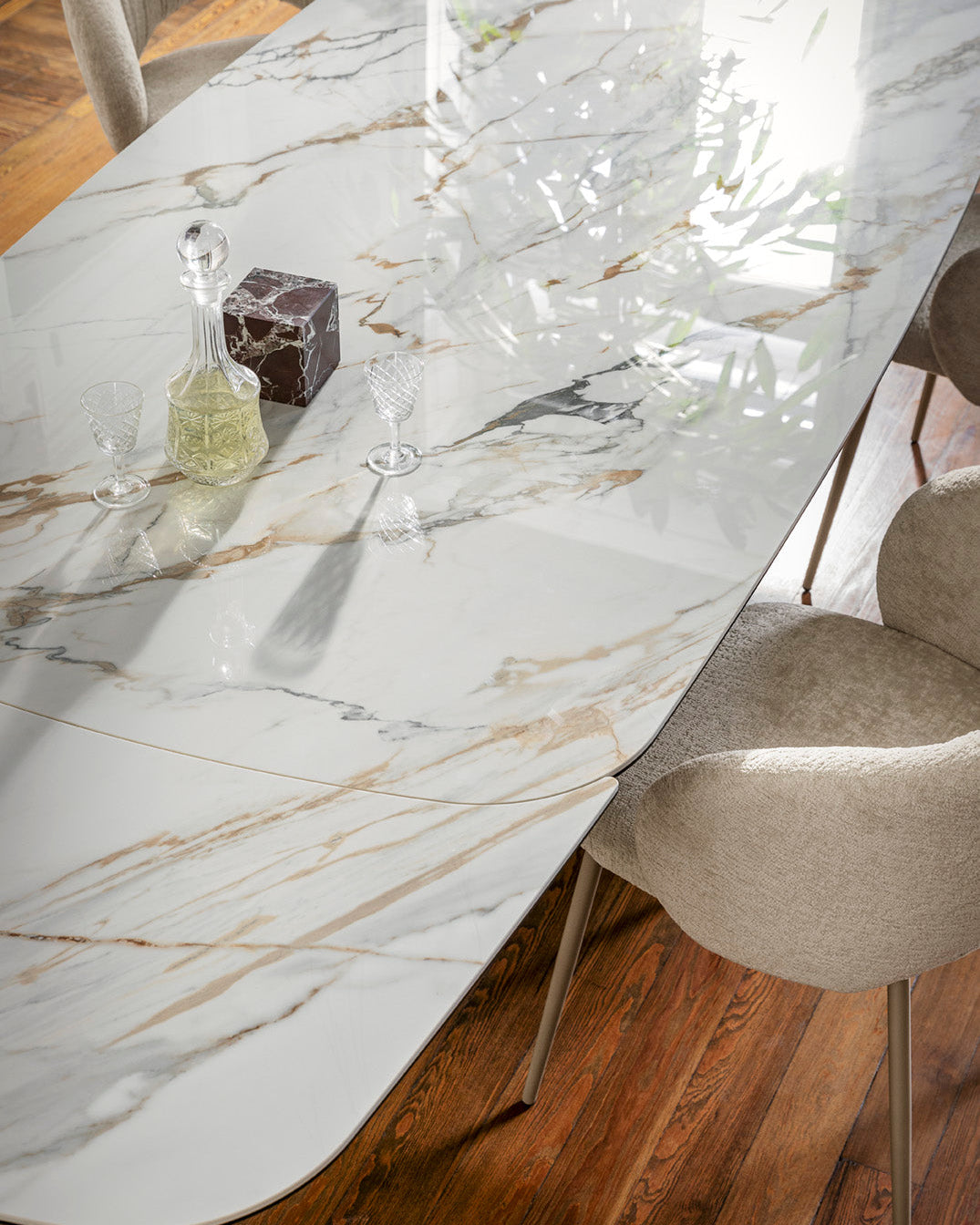 Marble-patterned dining table with chairs in a room setting