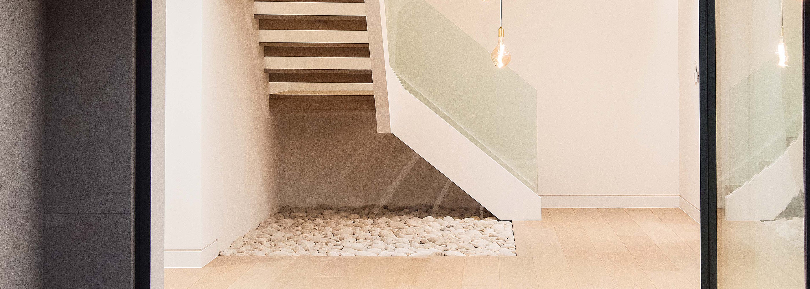 Modern wood flooring installation in a minimalist hallway—premium flooring design by Iroka Interiors, Cornwall.