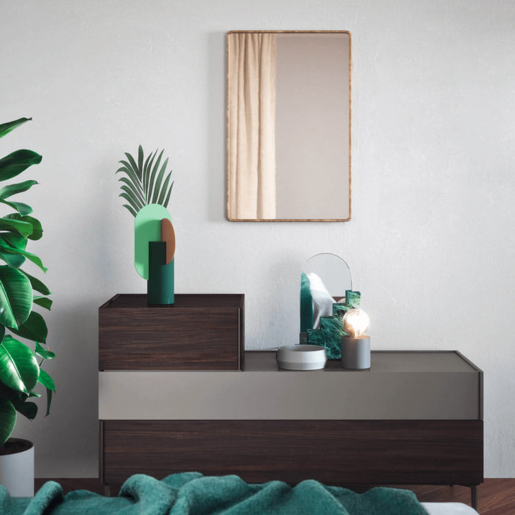 Giro Giro System by Novamobili – modern Italian modular drawer unit with layered design in walnut and matte taupe finish, styled with sculptural decor and mirror – available at Iroka Interiors Cornwall for contemporary bedroom and living room storage solutions.