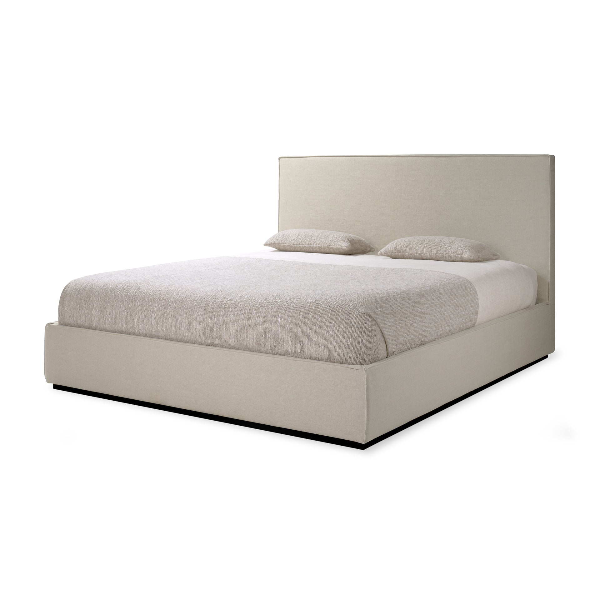 Beige upholstered bed with white bedding on a white background