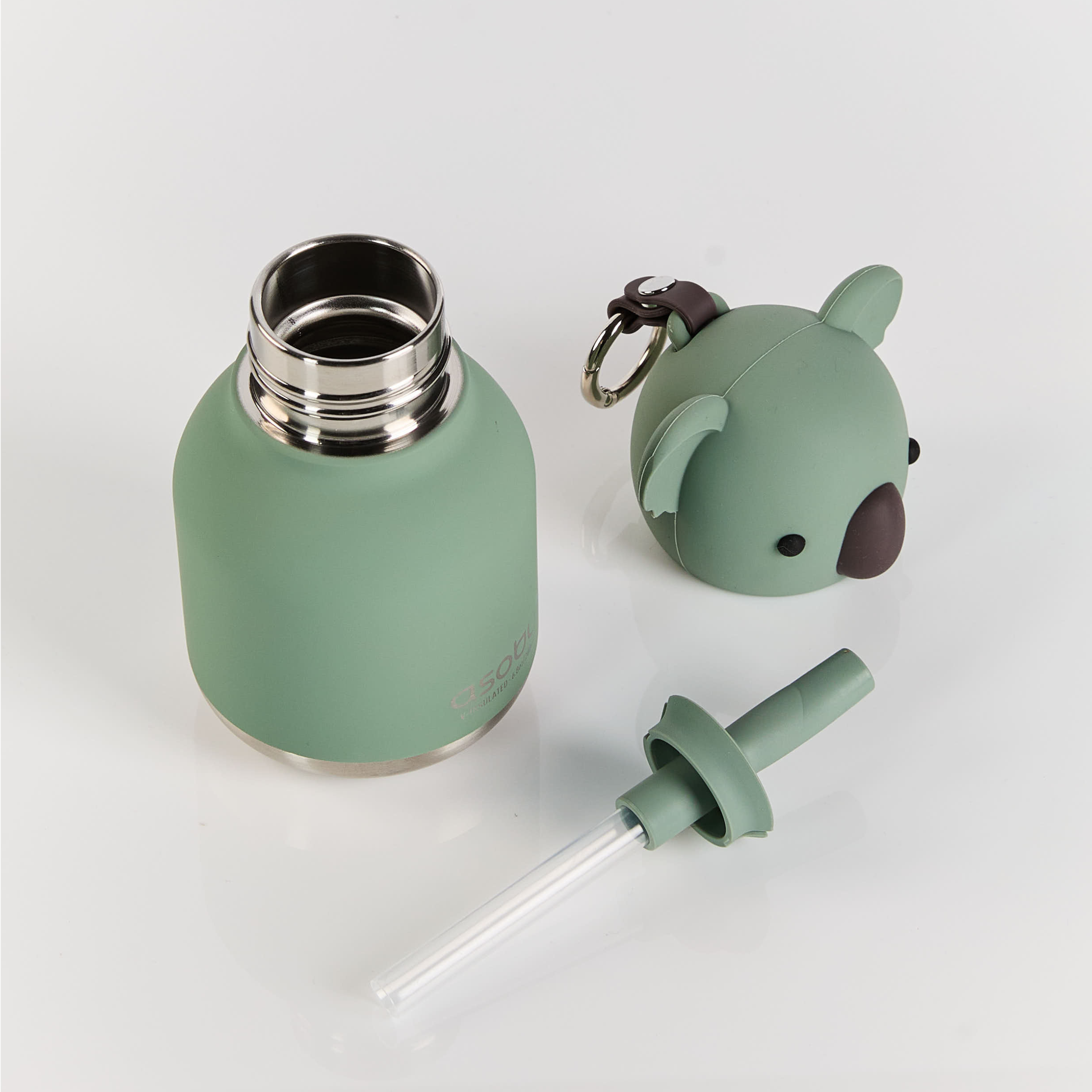 Green water bottle with keychain and straw on a light gray background
