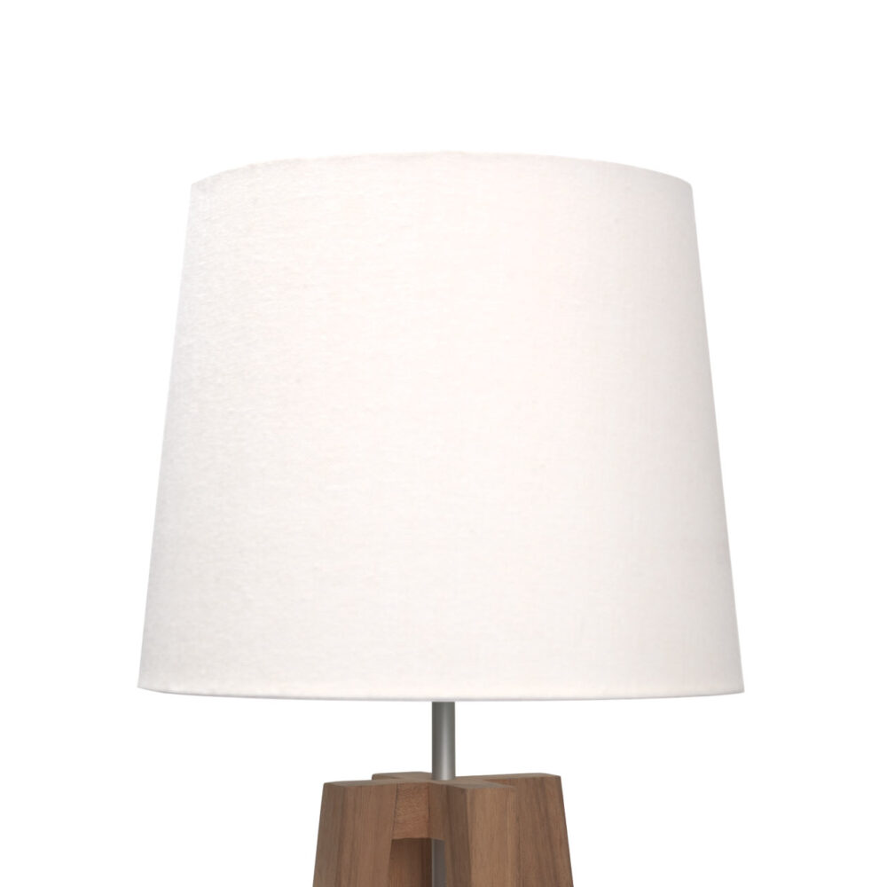 A table lamp with a large white fabric drum shade and a wooden tripod base, shown against a plain white background.