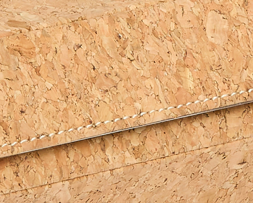 Close-up of cork watch roll with a horizontal line running through it