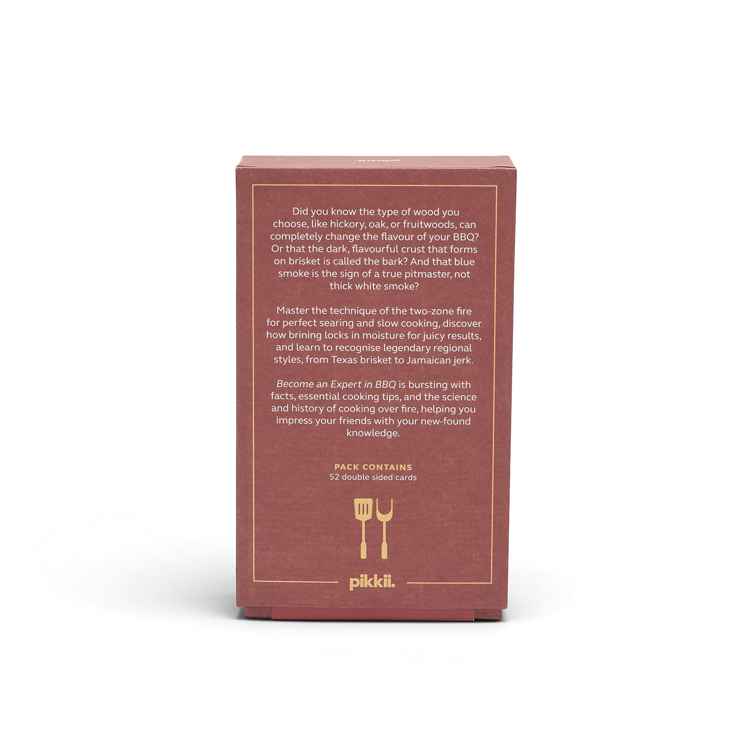 The back of a reddish-brown Pikkli BBQ guide book box, displaying white text about smoking techniques and a small gold fork and knife logo, set against a plain white background.
