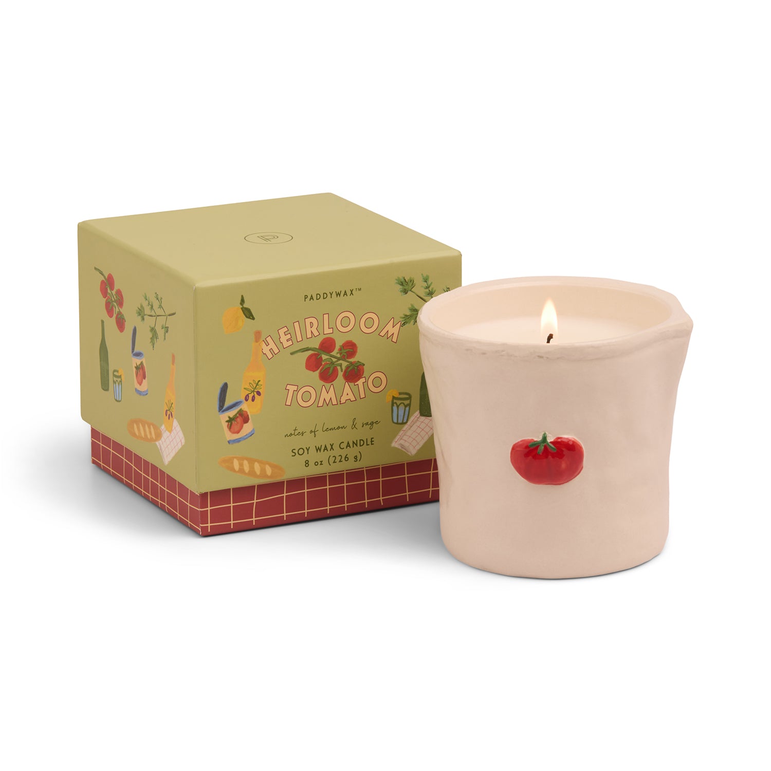 Candle with 'Heirloom Tomato' packaging on a white background