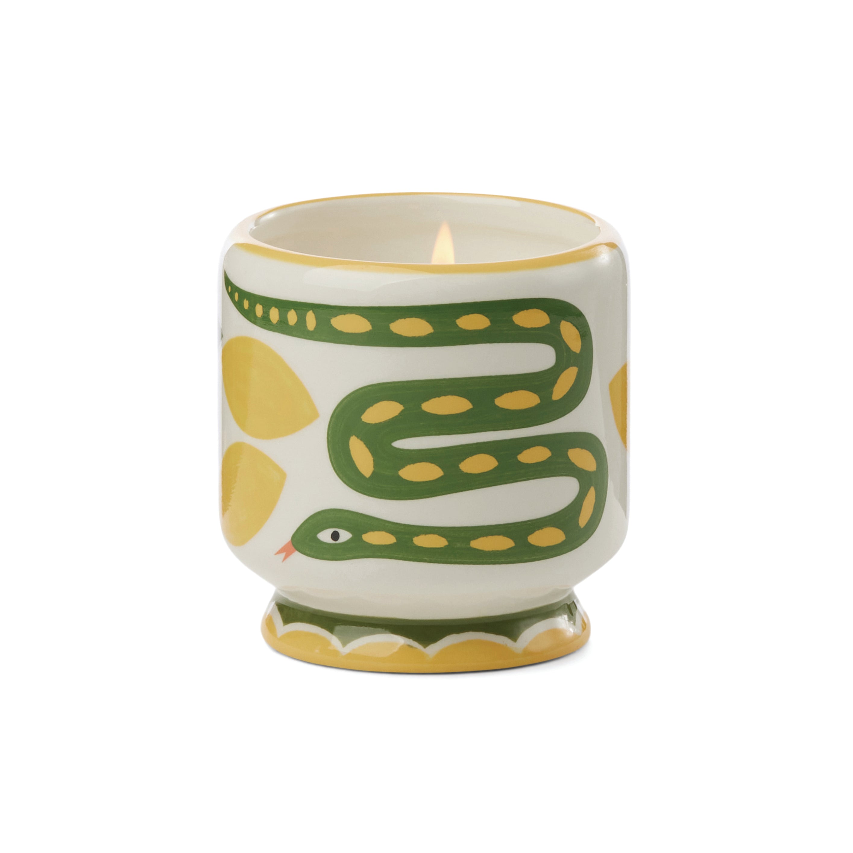 A white ceramic candle holder with a green and yellow snake design, shown lit on a plain white background.