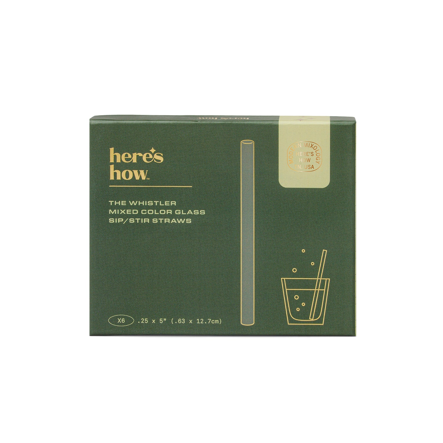 A dark green product box for 'here's how.' The Whistler mixed color glass sip/stir straws, featuring gold text and line drawings of a straw and a glass on a white background.