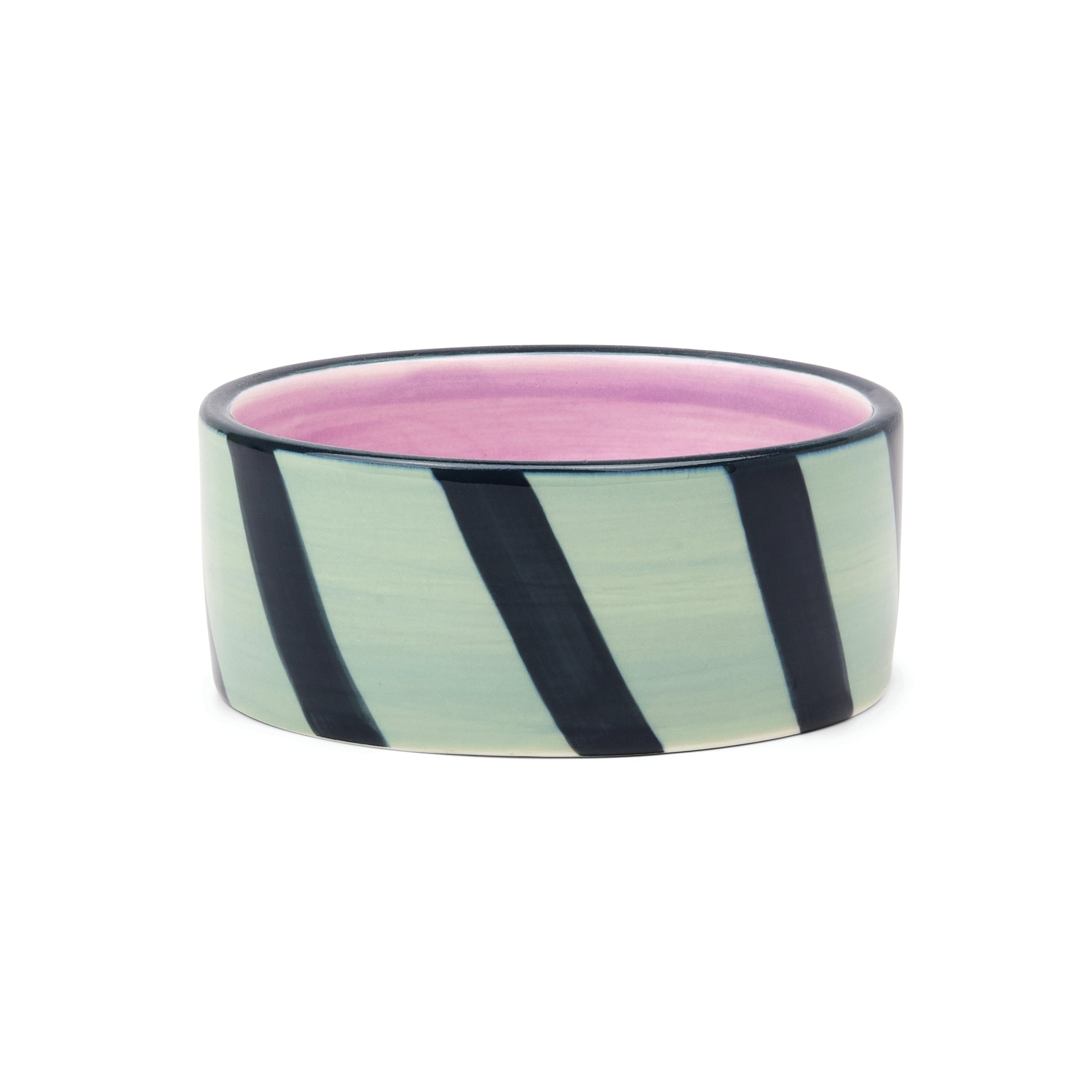 A round ceramic BOTTLE COASTER with a glossy finish, featuring diagonal black stripes on a light green exterior and a vibrant purple interior, set against a plain white background.