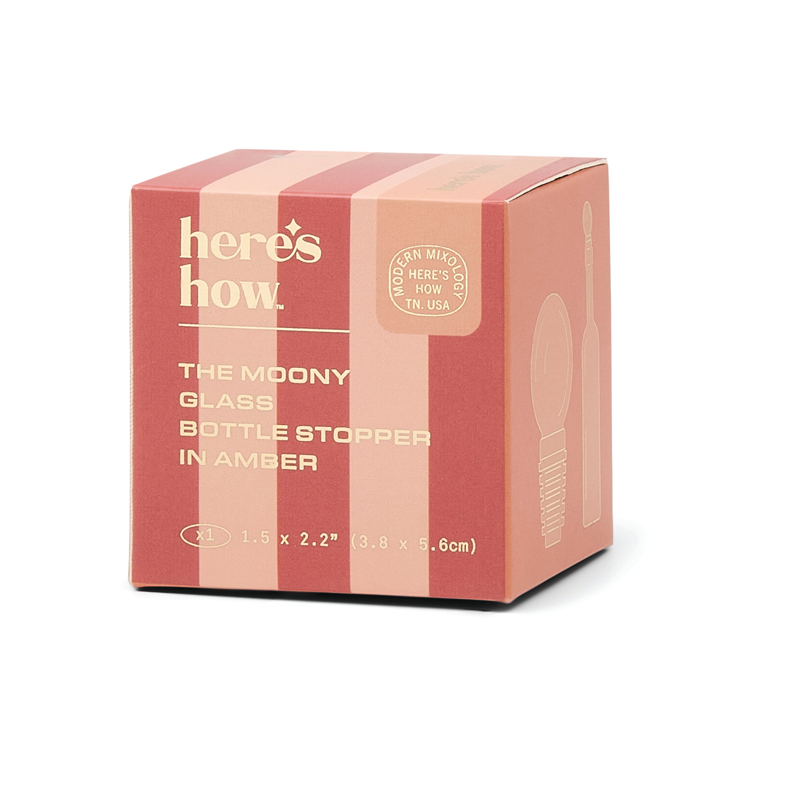 A pink and red striped cardboard box for 'here's how. The Moody Glass Bottle Stopper in Amber', shown on a clean white background.